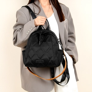 Fashionable black quilted nylon backpack with elegant diamond pattern for women
