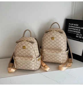 Comparison of small and large beige monogram backpacks with luxury leather texture