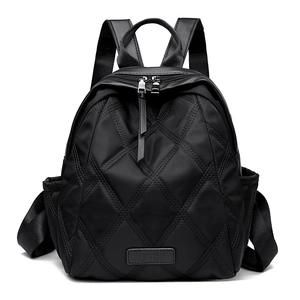 Chic black quilted backpack for women featuring stylish diamond stitching and adjustable straps