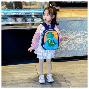Front view of a cartoon dinosaur toddler backpack with orange and blue color blocking
