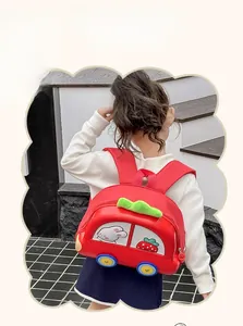Detail of red car-shaped EVA backpack with cute bunny pattern on a young girl's back