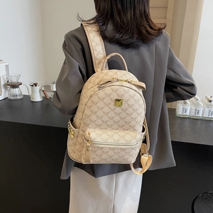 Beige logo print backpack for women with bow accent and gold hardware for travel