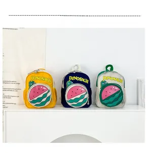 Three kids dinosaur backpacks in yellow, navy, and green with side mesh pockets