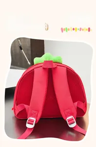 Detail of the breathable honeycomb mesh back and straps on the red strawberry kids backpack