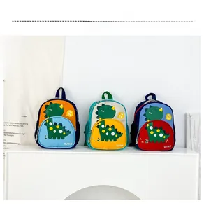 Three colorful cartoon dinosaur backpacks for kids in blue, green and red canvas detail