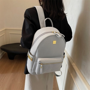Elegant stone pattern backpack for women with gold hardware and croc-effect embossing