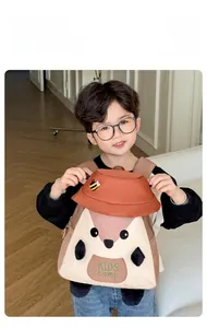 Toddler wearing a cute cartoon squirrel backpack with bee embroidery and KIDS camp logo