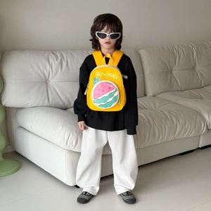 Kids yellow dinosaur backpack with watermelon pocket for toddlers in daily home setting