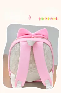 Detail of breathable honeycomb mesh back and padded shoulder straps on pink kids backpack
