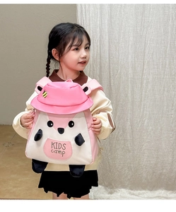 Detail of pink cartoon squirrel backpack with 3D elements and KIDS camp logo on kids