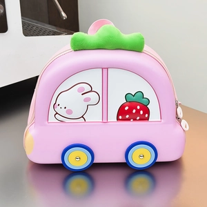 Detail of pink car-shaped kids backpack with strawberry graphics and 3D wheel accents