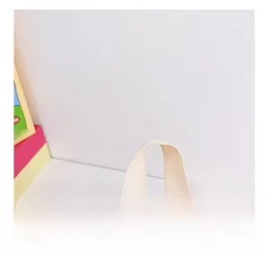 Detail showing the comfortable off-white woven handle on a pink canvas toddler backpack