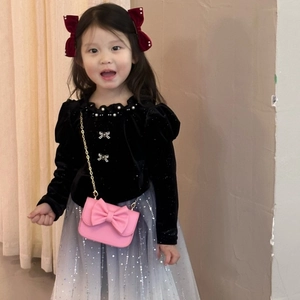 Pink bow chain handbag paired with a toddler girl black velvet top and sequin tulle skirt