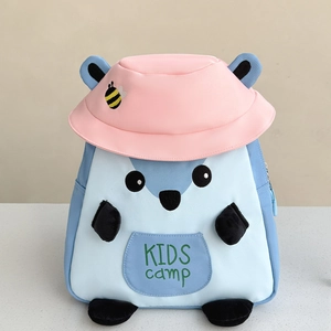 Detail of cute blue squirrel kids backpack featuring a pink bucket hat and bee embroidery
