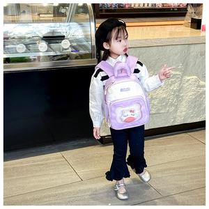Detail of toddler backpack featuring breathable purple mesh straps and plush cat doll decoration