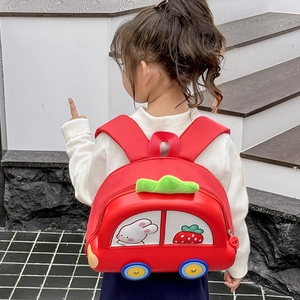 Kids red car-shaped backpack with strawberry patterns shown from a 45-degree angle