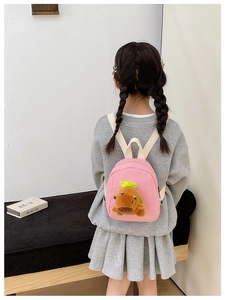 Pink mini children's backpack featuring a cute 3D plush Capybara on the back