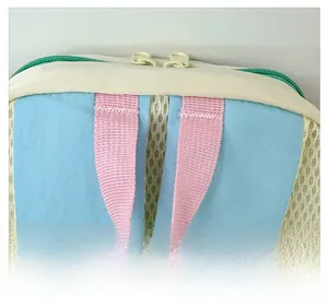 Close-up of the comfortable webbing handle and multi-color stitching on kids backpack
