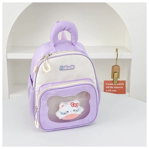 Detail of kids backpack with transparent pocket and cute white plush cat charm