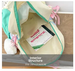 Detail view of the spacious inner compartment of the macaron color school backpack