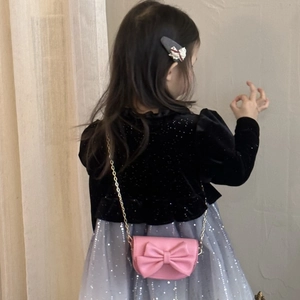 Pink mini crossbody bag for girls with a large bow detail and a gold chain strap
