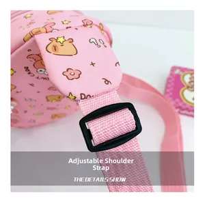 Detail of adjustable pink shoulder strap and black buckle on kids capybara crossbody bag