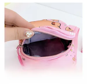 Internal view of pink cartoon children's bag showing spacious main compartment with zipper