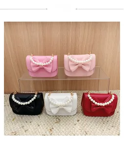 Mini handbags with large bows and pearl handles in five colors for children or girls