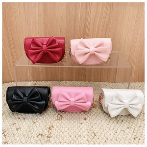 Mini children's shoulder bags with bow ties in red, pink, black and white colors
