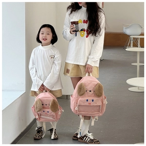 Pink cartoon puppy backpacks in two sizes featuring plush ears and a clear front pocket