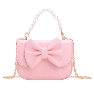 Pink kids handbag with large bow, pearl handle and gold chain strap on white background