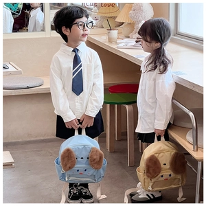Detail of cute cartoon dog backpack for kids with plush ears and transparent layer