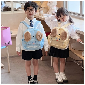 Detail of cute puppy kids backpack showing plush ears and clear front pocket