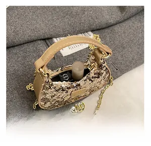 Interior view showing the compact capacity of this gold sequin mini bag for girls