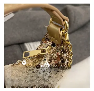 Close-up of golden sequins on girls crossbody bag with durable metal zipper and D-ring hardware