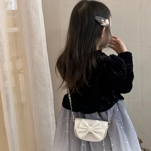 Girl's velvet top and sequined mesh skirt set with a mini white bow crossbody bag