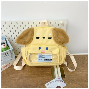 Detail of cute yellow cartoon puppy backpack featuring plush ears and a clear front pocket
