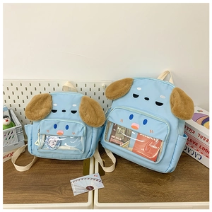 Detail of light blue puppy backpacks in large and medium sizes with transparent front pockets
