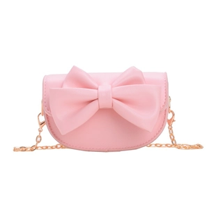 Pink semi-circular girls crossbody bag with large bow and gold metal chain strap