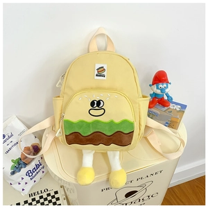 Close-up of cute cartoon hamburger backpack for kids with 3D legs and plush details