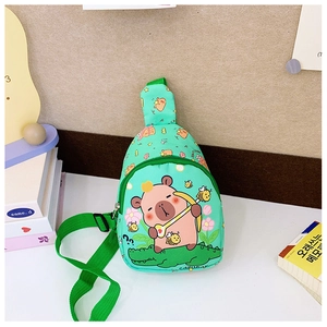 Close-up of green canvas kids bag featuring cute cartoon capybara and crocodile prints