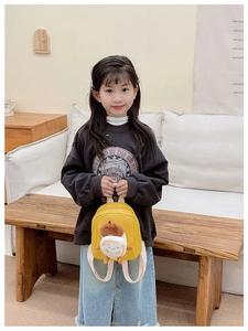 Miniature yellow canvas backpack for toddlers featuring a 3D plush cartoon toast design