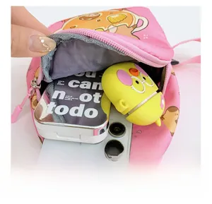 Detail view of pink Capybara mini chest bag showing interior capacity for essentials