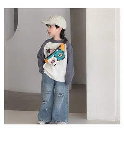 Close-up of kids crossbody bag featuring color-block design and adjustable strap