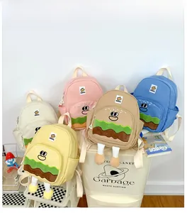 Close-up of cute cartoon hamburger backpacks in five colors with detailed 3D design