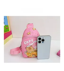 Detailed comparison showing pink Capybara mini chest bag size next to a smartphone