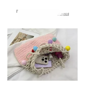 Pink and beige crochet tote bag interior showing capacity for phone and cosmetics