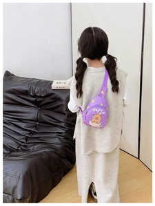 Rear view of a child wearing a purple Capybara chest bag in a modern home setting