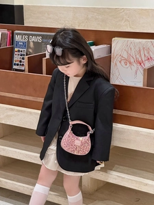 Pink sequin girls' handbag featuring a silver chain strap and half-moon silhouette