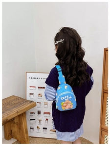 Rear view of a child wearing a blue Capybara cartoon chest bag with adjustable strap